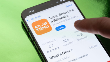 New York, USA - March 30, 2025: Opening Temu app on smartphone screen close up view