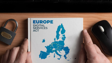 Digital services act concept: man hold a book with european union shape and the text Europe digital services act