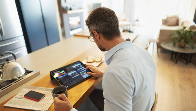 Businessman using digital tablet, working from home