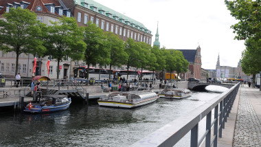 Tourists for canal tours copenhagen canal boat curisng in copenhagen denmark.