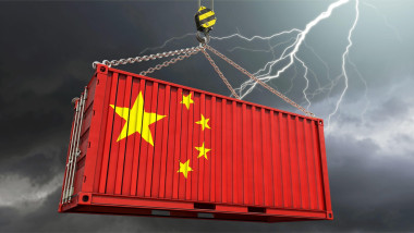 Chinese export economy - container in Chinese flag and thunderstorm in the background