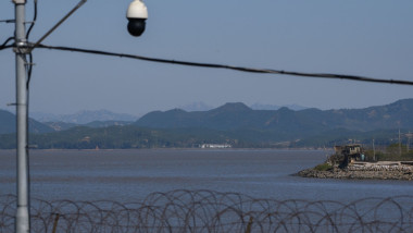 A South Korean guard post and security camera are seen behind a fence of the Demilitarized Zone (DMZ) separating North and South Korea, on the South Korean island of Ganghwa