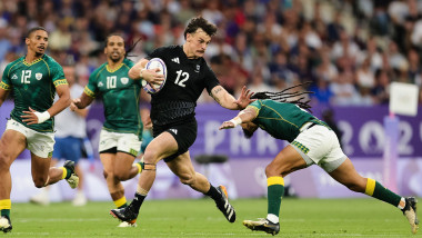 Paris, France, 25 July, 2024. Leroy Carter (12) of Team New Zealand runs the ball during the Paris 2024 Olympic Games Rugby Sevens match between South Africa and New Zealand Quarter Final at the Stade de France on July 25, 2024 in Paris, France. Credit: P