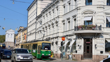 A streetcar/tram passing the corner of Unioninkatu street and Pohjoisesplanadi by the Kauppatori market place in central Helsinki, Finland August 2024