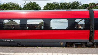 Fredericia, Jutland, Denmark, July 25, 2024 - Passenger train waiting at the platform of the railway station