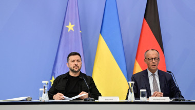 Ukrainian President Volodymyr Zelensky (L) and German Chancellor Friedrich Merz prepare for a talk of European leaders with the US Presiden