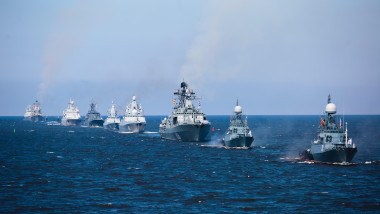 A line of modern russian military naval battleships warships in the row, northern fleet and baltic sea fleet in the open sea