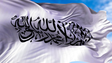 The flag of the Islamic Emirate of Afghanistan waving in the wind.