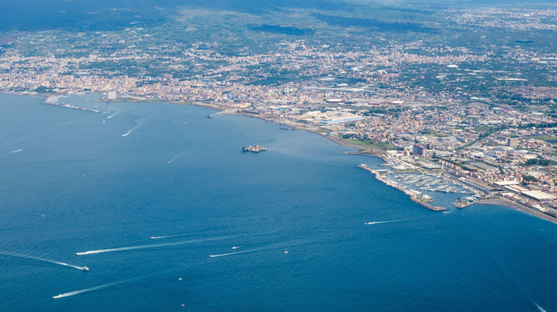 View from Monte Faito viewpoint overlooking Naples and Mount Vesuvius among the clouds, Italy.