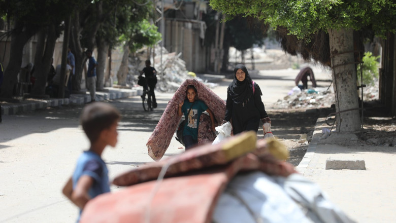 Palestinian residents flee from Al-Sabra neighborhood in Gaza City toward areas they believe to be safer