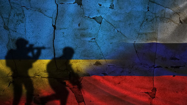 Russia vs Ukraine flag on cracked wall, concept of war between russia and ukraine, silhouette of soldiers on russia vs ukraine flag