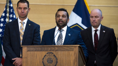 Kash Patel (C) speaks during a press conference