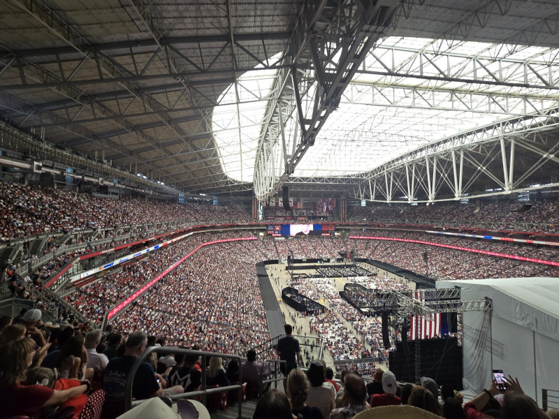 Donald Trumo jr. JD Vance and Donald Trump talk to people in suite next to their bullet proof glass suite during Charlie Kirk memorial in Arizona