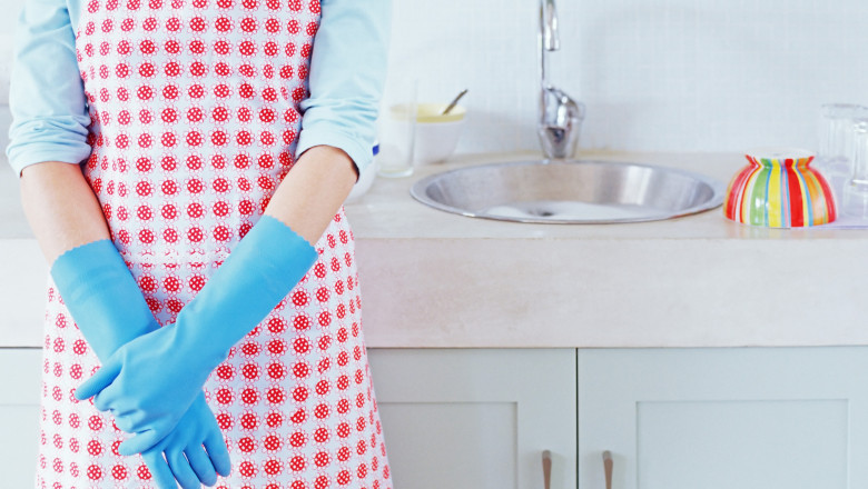 Woman by the kitchen sink