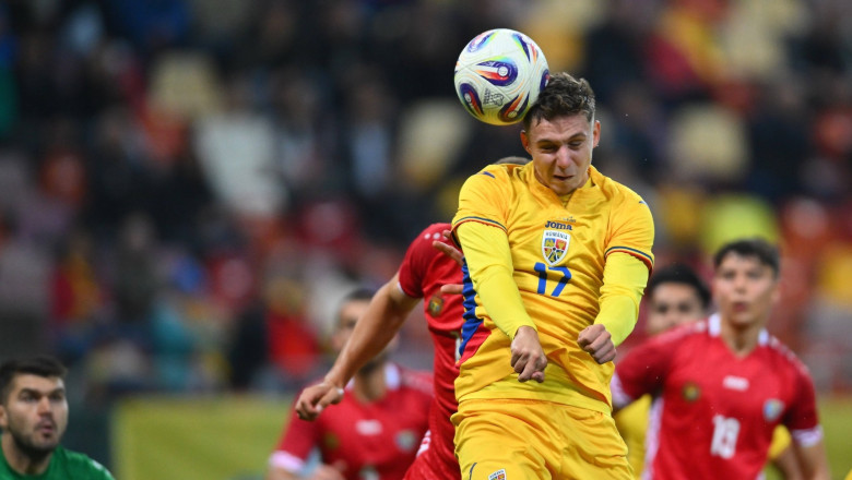 Louis Munteanu of Romania head strike in action during the friendly game between Romania and Moldova