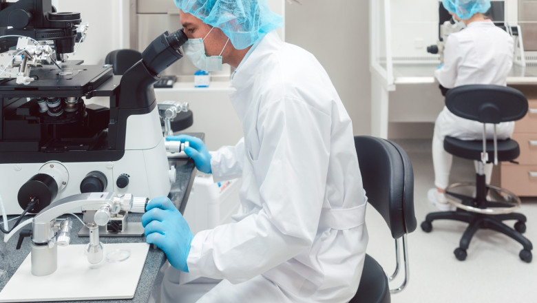 Scientist working on manipulator to fertilize human egg cells