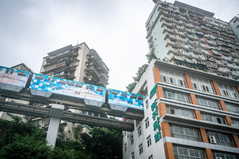 Chongqing China, 7 August 2019 : Chongqing metro train entering Liziba station famous for being inside a residential building in Chongqing China
