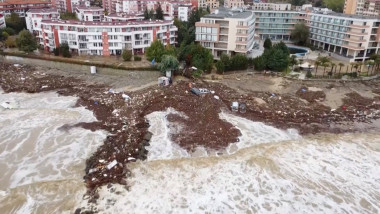 A drone view shows flooded buildings and cars in Elenite