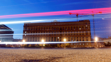 Cars drive near headquarters of the Federal Security Service in Moscow