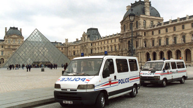 Police vans outside the Louvre Museum following an art theft, May 3. The museum was closed down and ..