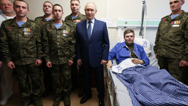 Russian President Vladimir Putin visits a military hospital in Moscow