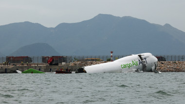 A cargo plane skids off the runway during landing at Hong Kong International Airport