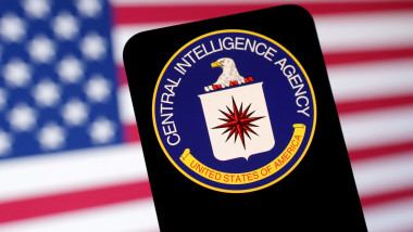 Illustration shows CIA (Central Intelligence Agency) logo and U.S. flag