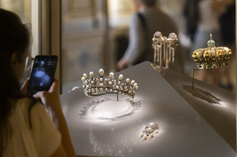 Tourists visit the famous Parisian museum Musee Du Louvre.