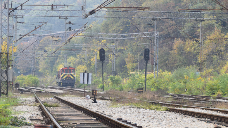 Old locomotive on the railroad in the autumn landscape