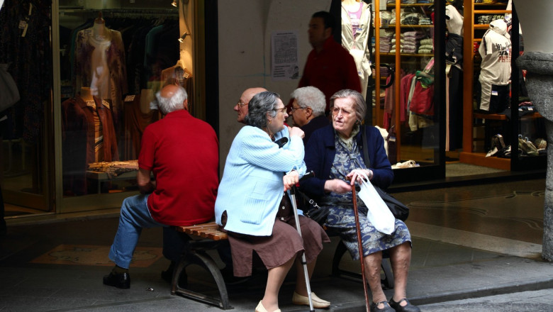 Old People sitting on a Bench in Chiavari in Liguria, Italy