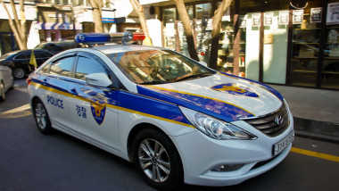 Hyundai Sonata Police Car. White with blue and yellow markings. Used by the National Police Agency in South Korea. Symbol of law and order in South Ko