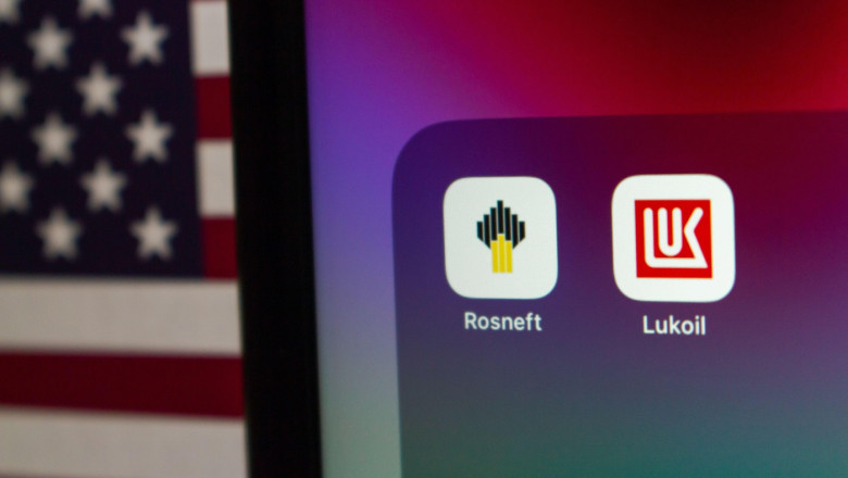 Quito, ECUADOR - Oct 27 2025 : Rosneft and Lukoil icons displayed on a screen with the U.S. flag in the background.