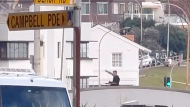 Chilling moment Bondi Beach gunman opened fire from bridge