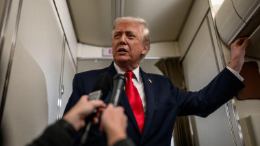 President Donald Trump answers questions from members of the media aboard Air Force One en route to Mount Pocono, Pennsylvania, for a rally on the economy, Tuesday, December 9, 2025. (Official White House Photo by Molly Riley)