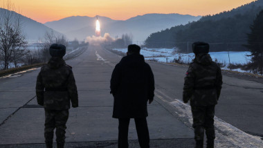 Jong Un, center, inspects test-flights of hypersonic missiles, in Pyongyang
