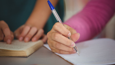 School kids doing homework in library