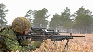 Canadian Army Private from 1st Battalion, Nova Scotia Highlanders, North, adjusts the sights on his C9 machine gun at the range during Exercise Southbound Trooper IX at Fort Pickett, Virginia, on February 16, 2009. The exercise demonstrates marksmanship a
