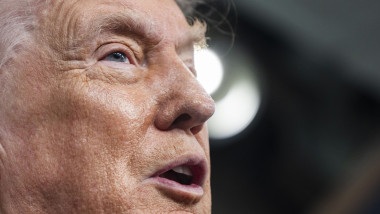 US President Trump speaks on to reporters ahead of trip to Davos