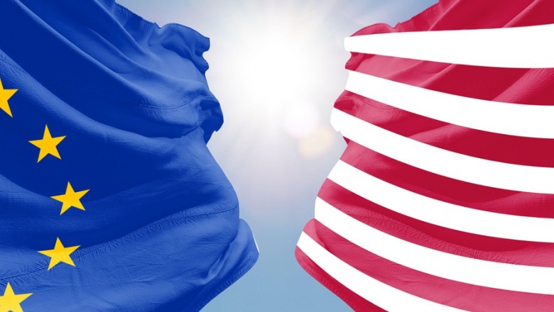 us europe flags. United States of America vs European Union.american taxtrade relations tax war