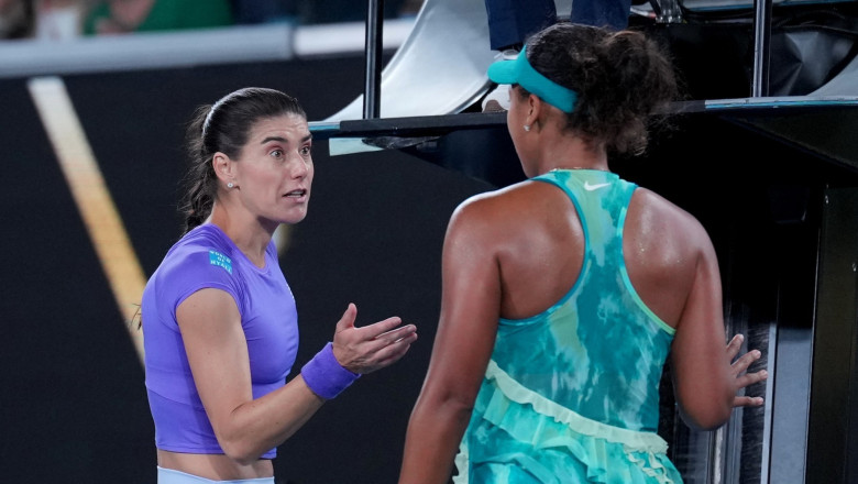 Naomi Osaka, right, of Japan talks with Sorana Cirstea, left, of Romania following their second round match at the Australian Open