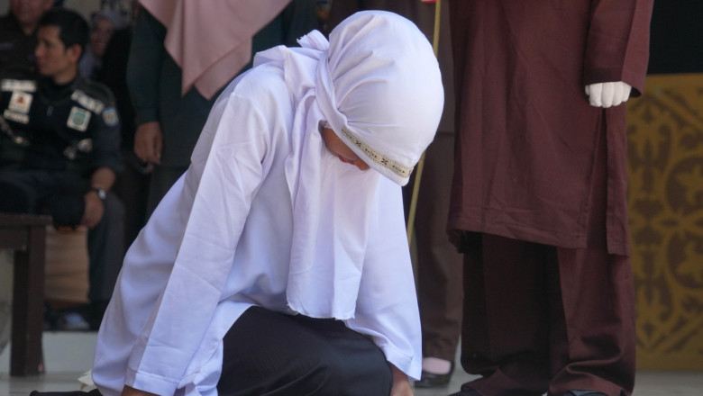 Three Couples Who Violated Sharia Law Were Executed By Caning In Banda Aceh, Aceh, Indonesia.