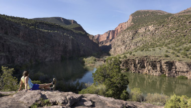 Woman trail runs Gates of Lodore Green River canyon Dinosaur National Monument Colorado