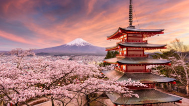 Fujiyoshida, Japan at Chureito Pagoda and Mt. Fuji in the spring with cherry blossoms.