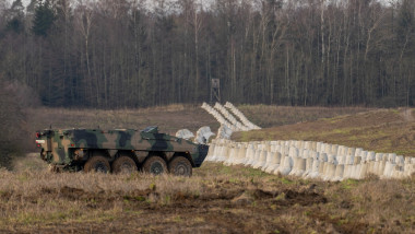 KTO Rosomak next to the Concrete barriers that are part of Poland's East Shield fortification at Poland's border with Russia in Dabrowka