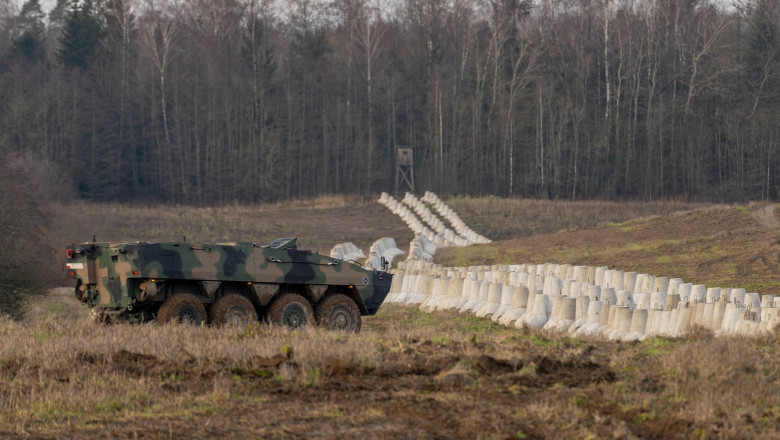 KTO Rosomak next to the Concrete barriers that are part of Poland's East Shield fortification at Poland's border with Russia in Dabrowka