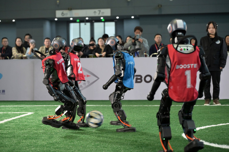 SHIJIAZHUANG, CHINA - OCTOBER 17: Humanoid robots compete during a soccer game of China Robot Competition and 2025 Robot