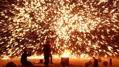 Performers stage a molten iron fireworks show in Anyang, central China's Henan Province