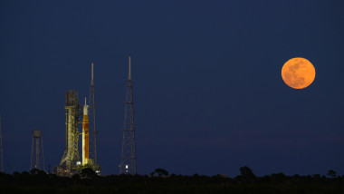 Snow Moon Rises Behind NASA Artemis II Rocket