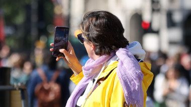 Mobile phone users in London, UK - 19 May 2025