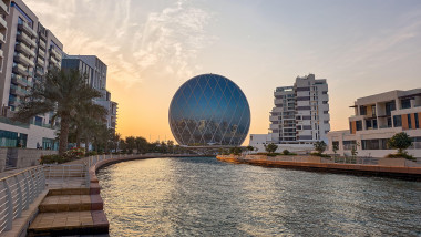 Abu Dhabi, United Arab Emirates - January 10, 2026: The iconic Aldar Headquarters circular glass skyscraper in the Abu Dhabi skyline with its distinct